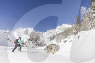 Woman spurts through winter landscape