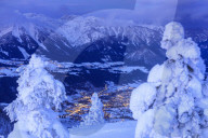 Illuminated valley in winter landscape