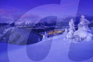 Illuminated valley in winter landscape