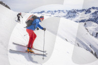 Couple skiiing downhill