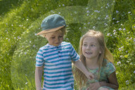 Two Children together on a Meadow