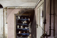 Wabi-Sabi Living Concept, Woman at Kitchen Cupboard