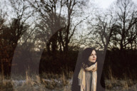 Woman enjoying the Sundown on a Winter Day