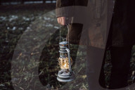 Man holding an Oil Lamp in his Hand