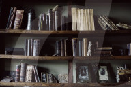 Bookshelf with old Books and old Photographs