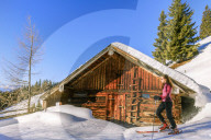Young woman on a ski hike