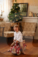 Boy playing with a toy Fire Truck