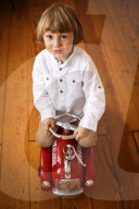 Boy playing with a toy Fire Truck