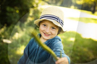 Young Boy wearing a Strawhat