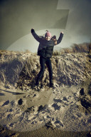 Girl jumping from a Dune in Rantum, Sylt