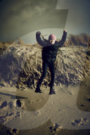 Girl jumping from a Dune in Rantum, Sylt