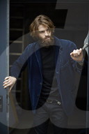 Portrait of a Man with Full Beard wearing a blue Jacket