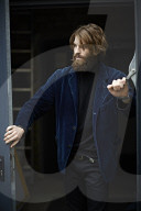 Portrait of a Man with Full Beard wearing a blue Jacket