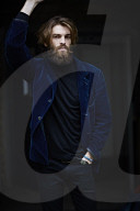 Portrait of a Manwith Full Beard wearing a blue Jacket