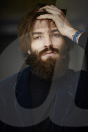 Portrait of a Man with Full Beard wearing a blue Jacket