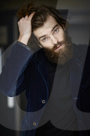 Portrait of a Man with Full Beard wearing a blue Jacket