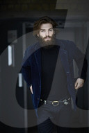 Portrait of a Man with Full Beard wearing a blue Jacket