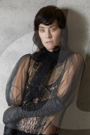 Young Woman wearing a black Lace Blouse