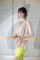Sporty young Woman at a Ballet Bar