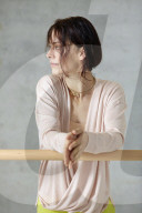 Sporty young Woman at a Ballet Bar