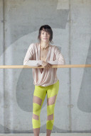 Sporty young Woman at a Ballet Bar