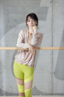 Sporty young Woman at a Ballet Bar