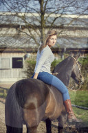 Woman enjoying her Leisure Time at a Riding Stable