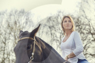 Woman enjoying her Leisure Time at a Riding Stable