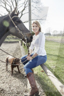 Woman enjoying her Leisure Time at a Riding Stable