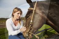 Woman enjoying her Leisure Time at a Riding Stable
