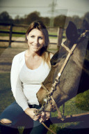 Woman enjoying her Leisure Time at a Riding Stable