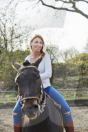 Woman enjoying her Leisure Time at a Riding Stable