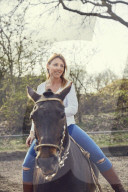 Woman enjoying her Leisure Time at a Riding Stable