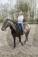 Woman enjoying her Leisure Time at a Riding Stable