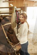 Woman enjoying her Leisure Time at a Riding Stable
