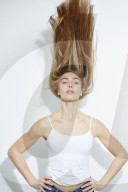 Young blonde Woman shaking her Head