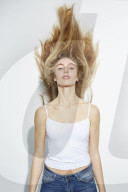 Young blonde Woman shaking her Head