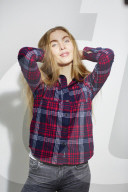 Young Woman wearing a checked Flannel Shirt