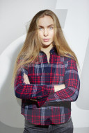 Young Woman wearing a checked Flannel Shirt