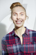 Young Woman wearing a checked Flannel Shirt