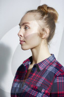 Young Woman wearing a checked Flannel Shirt