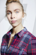 Young Woman wearing a checked Flannel Shirt