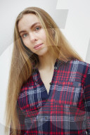 Young Woman wearing a checked Flannel Shirt