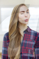 Young Woman wearing a checked Flannel Shirt