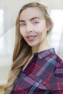 Young Woman wearing a checked Flannel Shirt