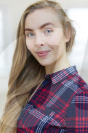 Young Woman wearing a checked Flannel Shirt