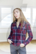 Young Woman wearing a checked Flannel Shirt