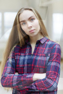 Young Woman wearing a checked Flannel Shirt