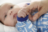Baby grabbing a Finger