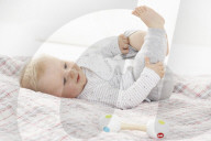 Toddler lying on a Blanket